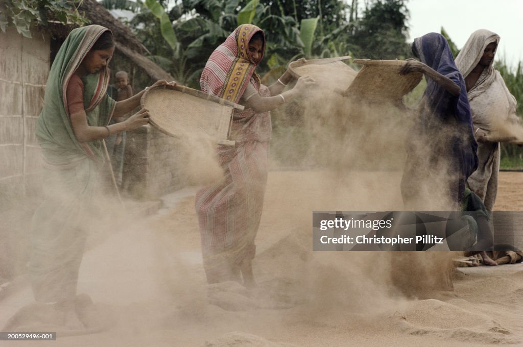 India, Bangladesh, women sifting...