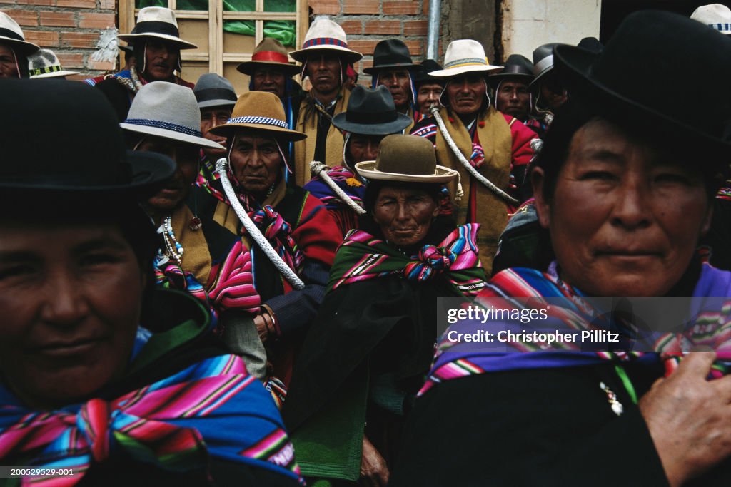 Bolivia, Altiplano, Aymara Indians in traditional dress at fiesta