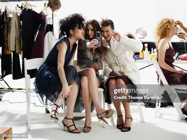 female models photographing themselves with camera phone - backstage sign stock pictures, royalty-free photos & images