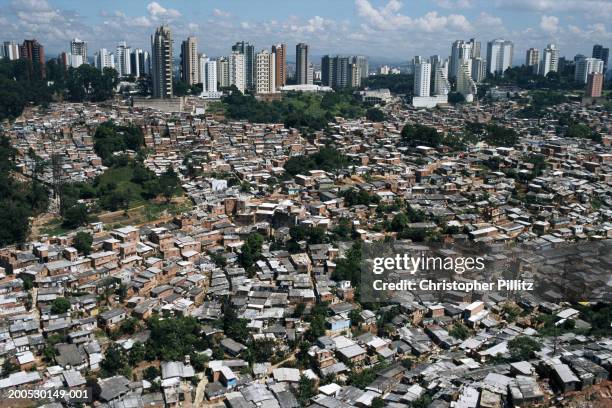 Aeriel view of a large favela with luxury apartment blocks in Sao Paulo city, Brazil.