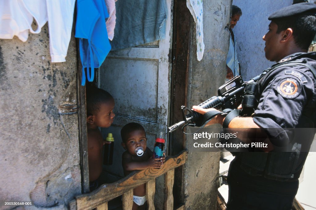 Bope Police Rio Mar 2004, Rio de Janerio. A police officer from the BOPE special task ...