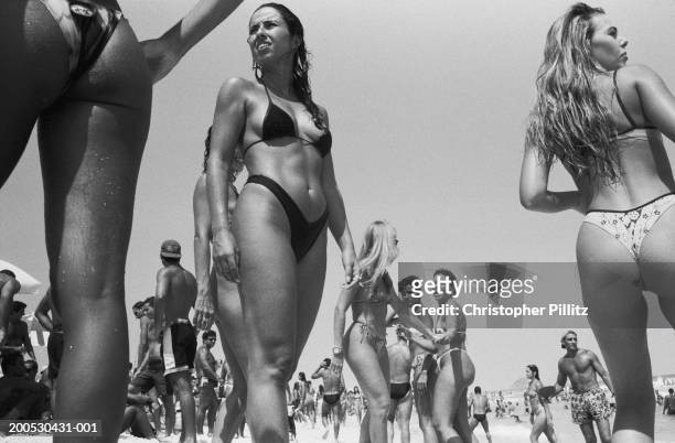 Mar 1994, Pepe Beach. Brazil, Rio de Janeiro, women on beach, low angle view .
