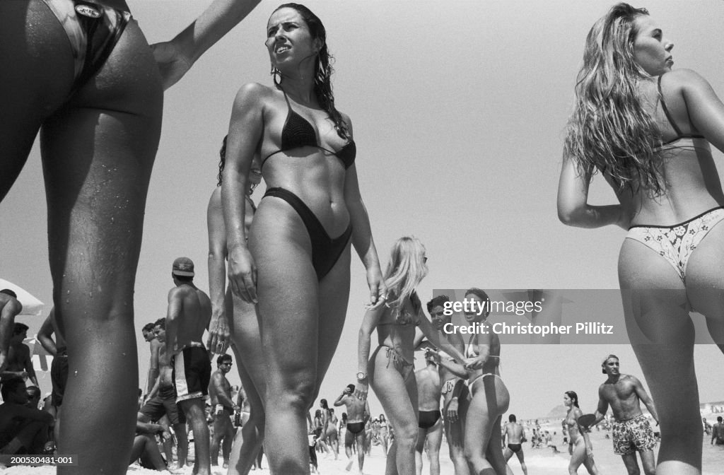 Brazil, Rio de Janeiro, women on beach, low angle view (B&W)