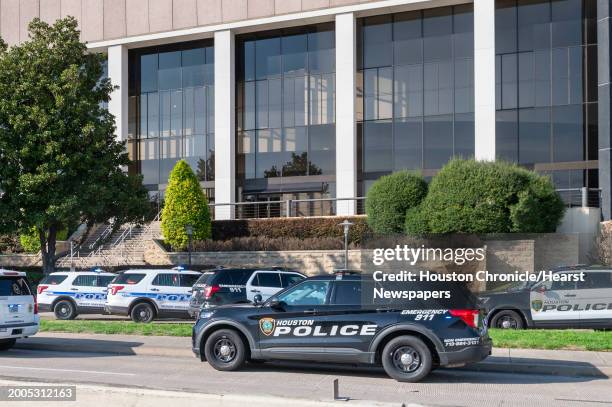 Emergency vehicles line the feeder road outside Lakewood Church during a reported active shooter event Sunday, Feb. 11, 2024 in Houston.