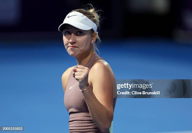 Anastasia Potapova celebrates a poin against Martina Trevisan of Italy in their first round women's singles match during the Qatar TotalEnergies...