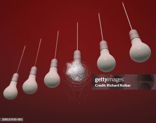 six lightbulbs hanging in row as one explosed - low angle portrait studio stock illustrations