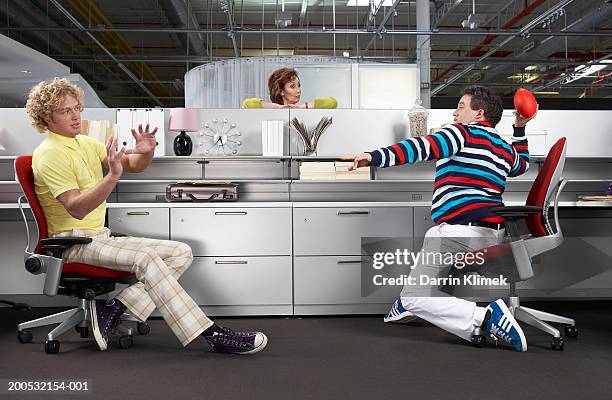 manager catching office workers playing football at desks - gag ball stock pictures, royalty-free photos & images