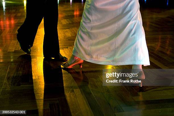couple dancing on wooden floor in club, low section - evening wear stock pictures, royalty-free photos & images