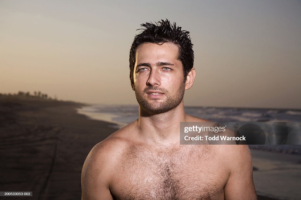 Young man on beach, close-up