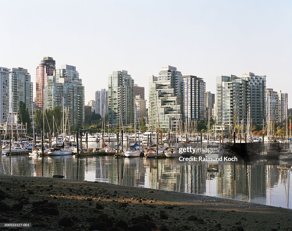 Canada, British Columbia, Vancouver, yachts moored in marina, city skyline in background