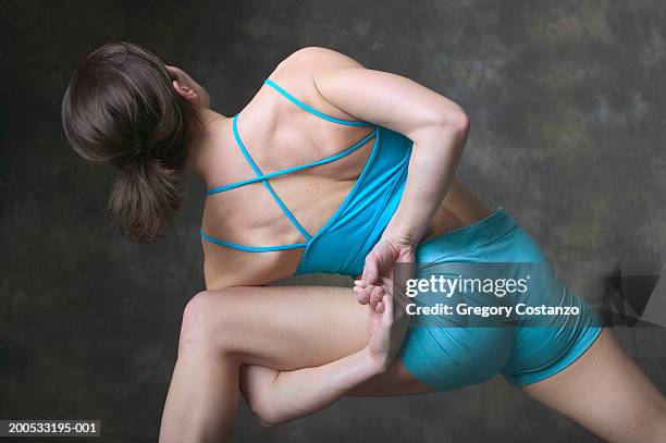 woman doing yoga, rear view - legs spread woman stock pictures, royalty-free photos & images