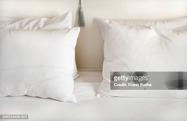 white pillows on bed - bedding stock-fotos und bilder