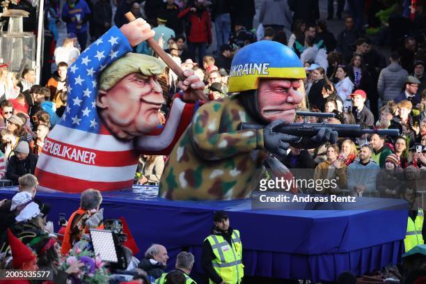 Parade float shows an effigy of Donald Trump stabbing an Ukrainian soldier with a dagger at the annual Rose Monday Carnival parade on February 12,...