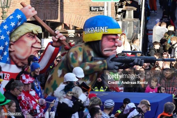 Parade float shows an effigy of Donald Trump stabbing an Ukrainian soldier with a dagger at the annual Rose Monday Carnival parade on February 12,...