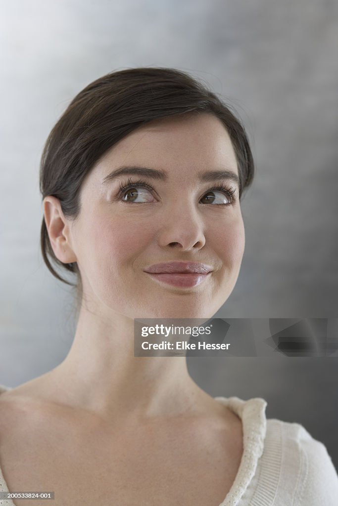 Woman looking up, close-up, portrait