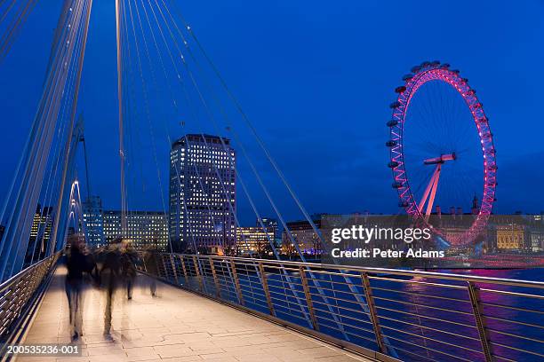 uk, london, golden jubilee bridge and millennium wheel, dusk - millennium wheel stock pictures, royalty-free photos & images