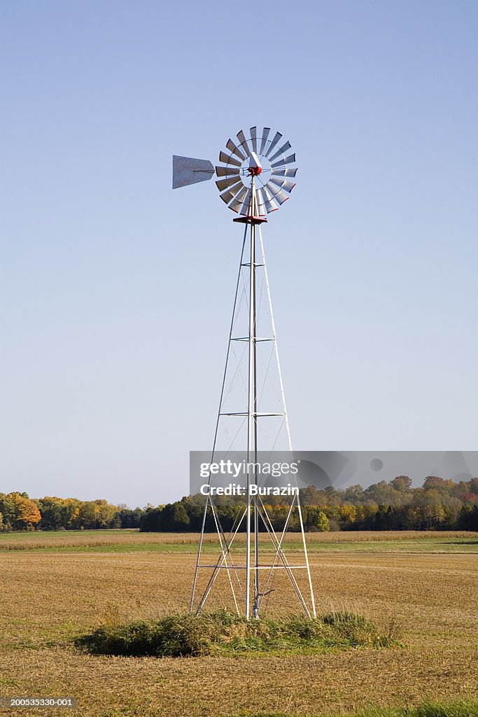 Windmill in field