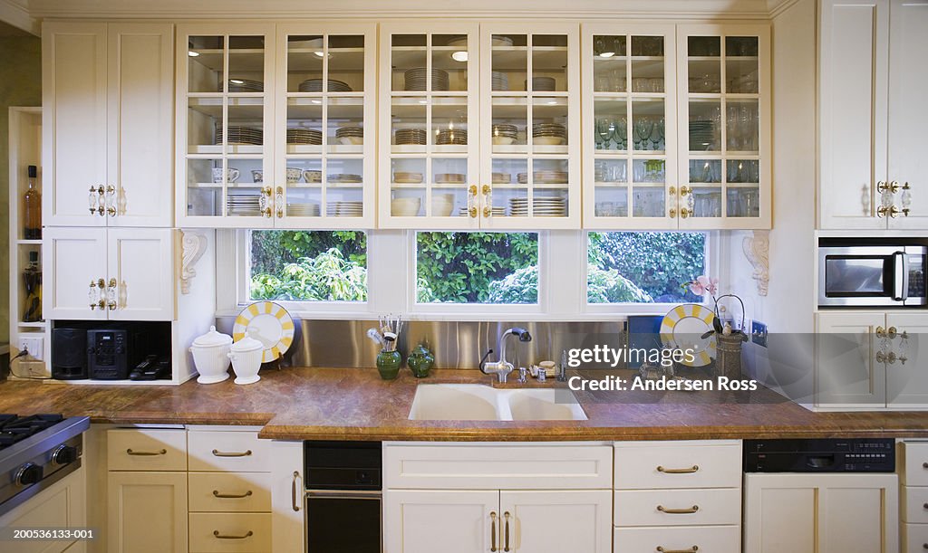 Sink, countertop and cabinets in domestic kitchen