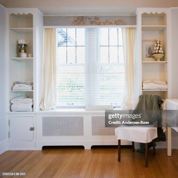 chair beside windows in bedroom - blinds stock pictures, royalty-free photos & images