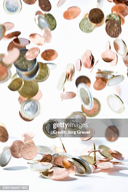 euro coins falling, (blurred motion) - european union coin stock pictures, royalty-free photos & images