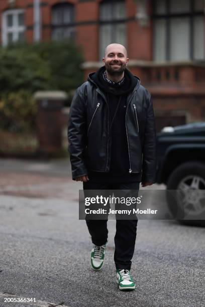 Benjamin Beyer aka David Puentez seen wearing black oversized cotton hoodie, black leather biker jacket, black denim straight leg jeans / pants and...