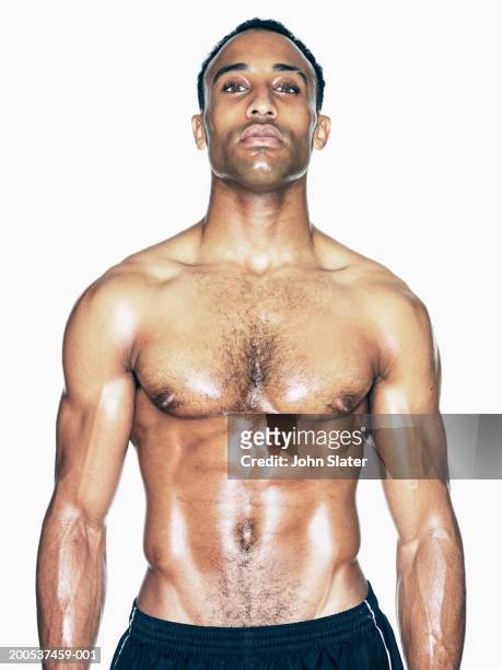 bare chested young man, portrait - pectoral muscle stockfoto's en -beelden
