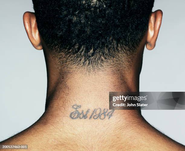 young man with tattoo on neck, close-up, rear view - back tattoo stock pictures, royalty-free photos & images