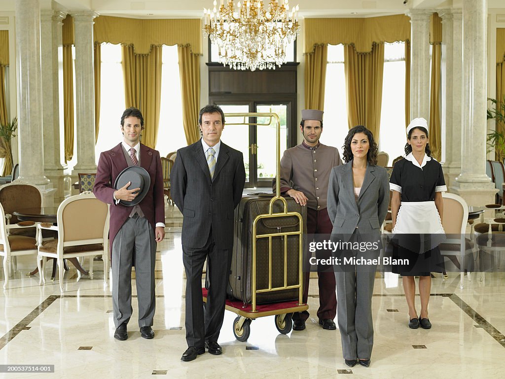 Hotel staff standing in foyer, portrait