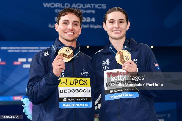 Domonic Bedggood and Maddison Keeney of Australia shows the gold medal after competing in the diving 3m Springboard Synchro Mixed Final during the...