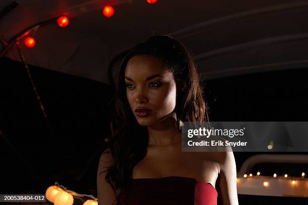 young woman wearing  evening dress on yacht, night - angry woman red stock pictures, royalty-free photos & images