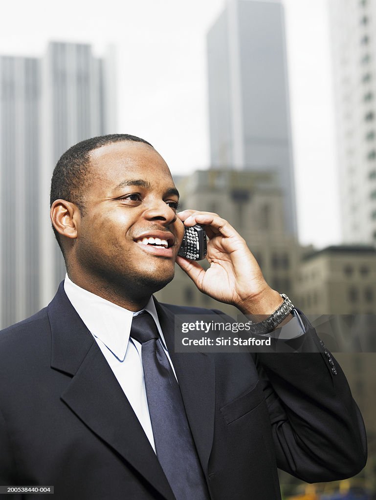 Young businessman using mobile phone