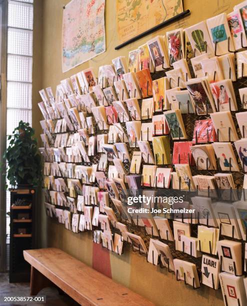 greeting cards displayed on wall in shop - showing card stock pictures, royalty-free photos & images