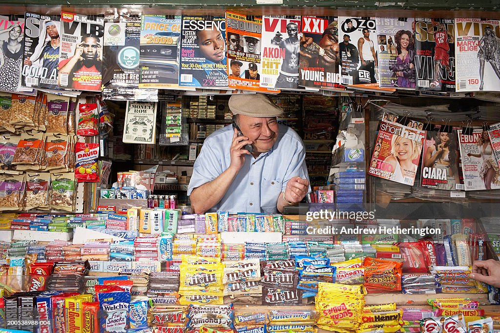 News and magazine kiosk operator using telephone