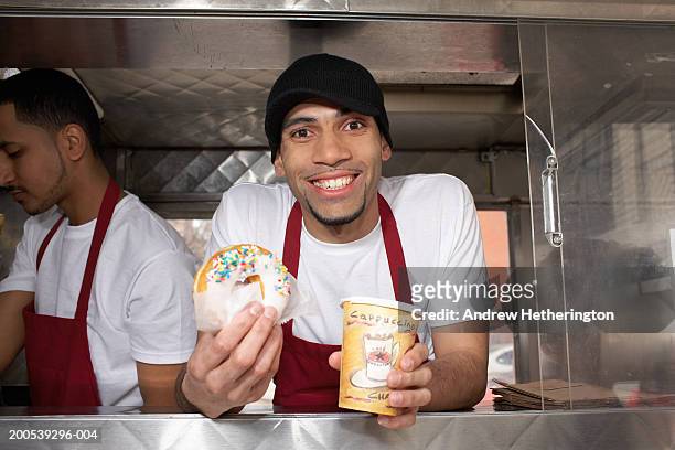 coffee wagon vendor offering doughnut and coffee, portrait - donut man stock pictures, royalty-free photos & images