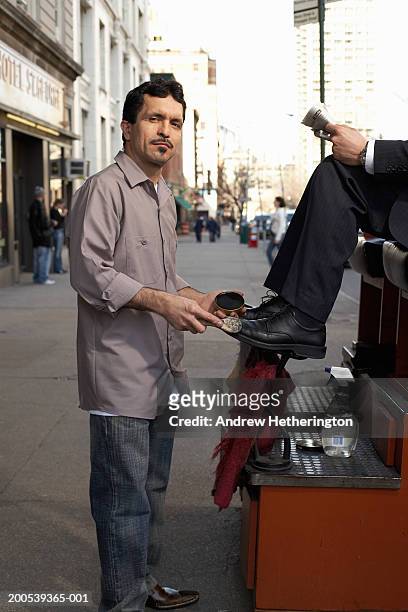 shoeshine man with customer on sidewalk, portrait - shoe polish stock pictures, royalty-free photos & images