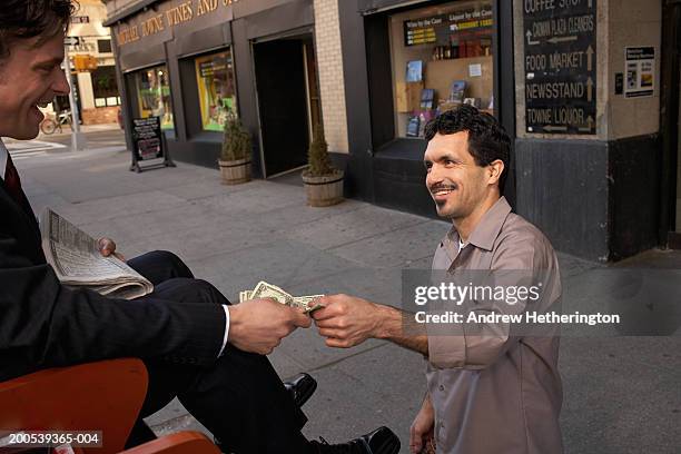 customer paying for shoeshine - polishing shoes stock pictures, royalty-free photos & images