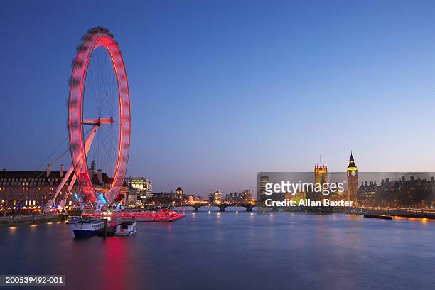 uk, london, river thames, millennium wheel illuminated at dusk - ロンドン・アイ ストックフォトと画像