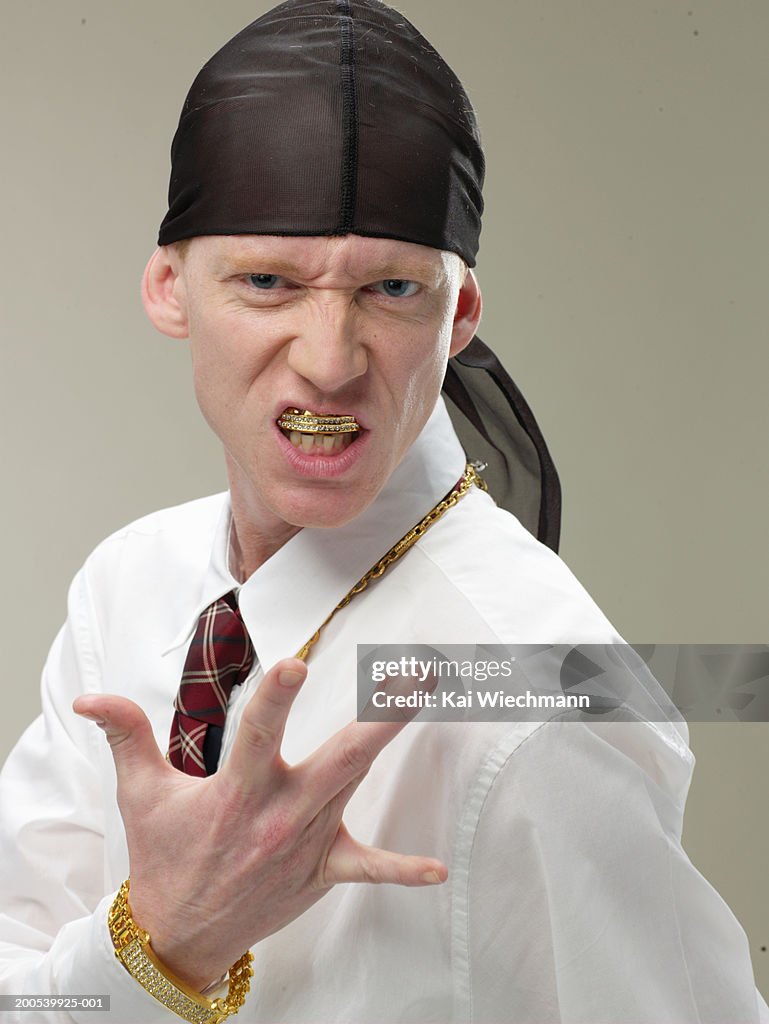 Young businessman wearing do-rag, gesticulating