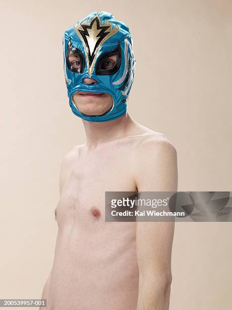 barechested young man wearing superhero mask - slim stock pictures, royalty-free photos & images
