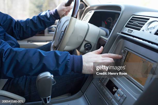 man driving van, checking route on navigation system, close-up - automotive navigation system stock pictures, royalty-free photos & images