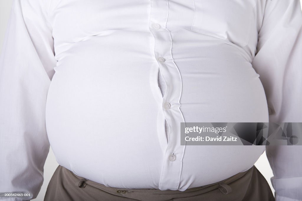 Man with enlarged stomach, too small shirt, mid section, close-up