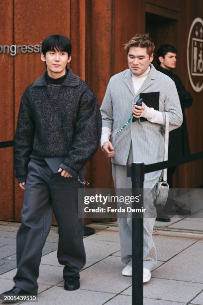 Guests wear bobby relaxed knitted polo sweater, gray wool wide leg pant and Miyake Japanese pleated suit jacket suit outside Zegna show during the...