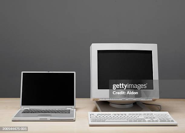 old and new technology, still-life - old monitor computer stock-fotos und bilder