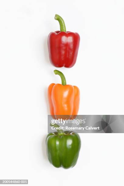 red, orange and green peppers, close-up - groene paprika stockfoto's en -beelden