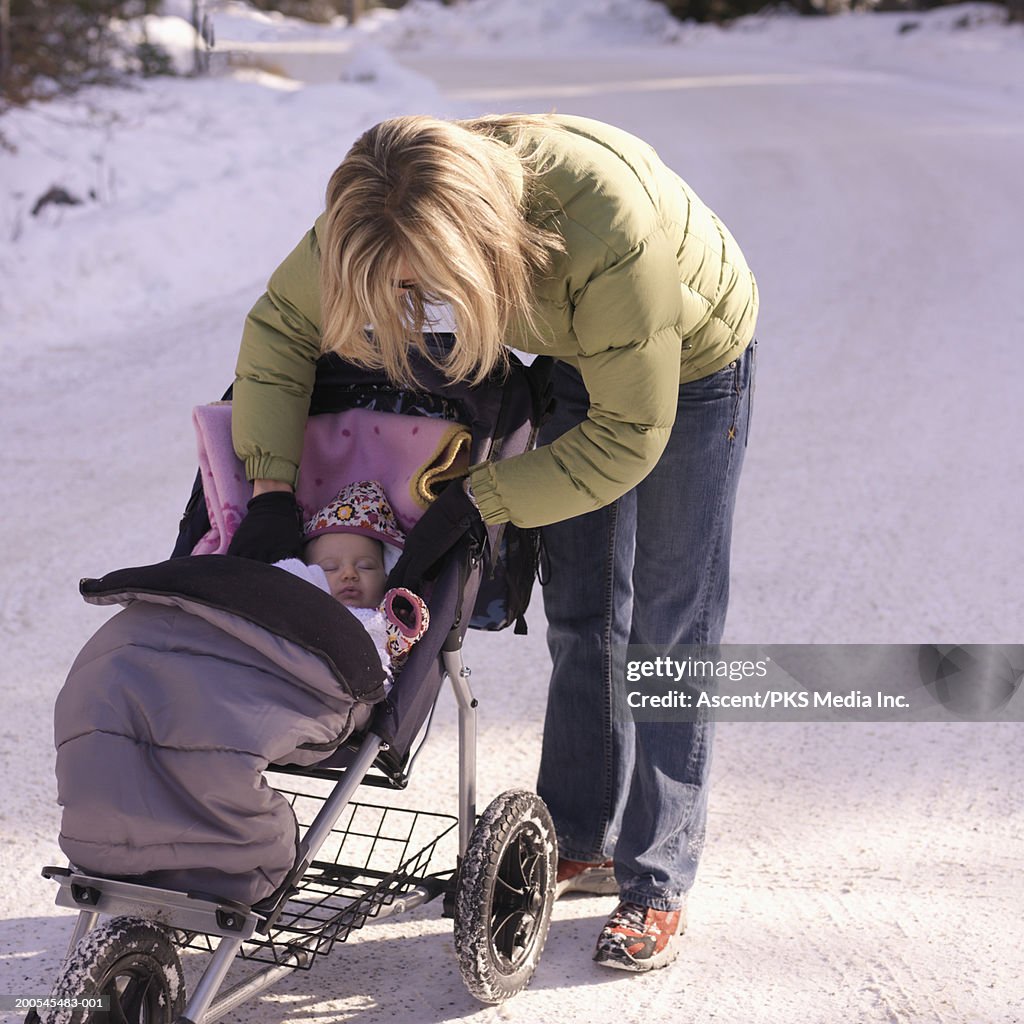 Mother with baby girl (4-5 Months) in stroller, elevated view