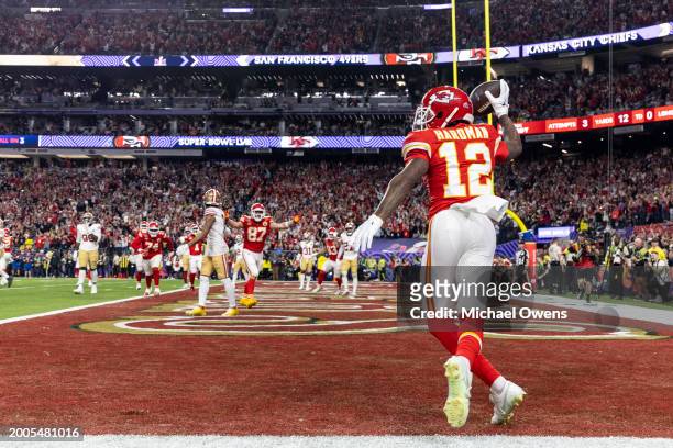 Mecole Hardman Jr. #12 of the Kansas City Chiefs celebrates after scoring a touchdown in overtime to win during the NFL Super Bowl 58 football game...