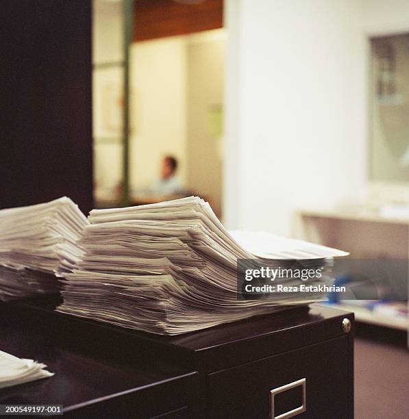 stacks of papers on desk - document stack stock pictures, royalty-free photos & images