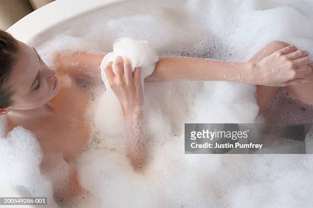 young woman in bath, elevated view - taking a bath stock pictures, royalty-free photos & images