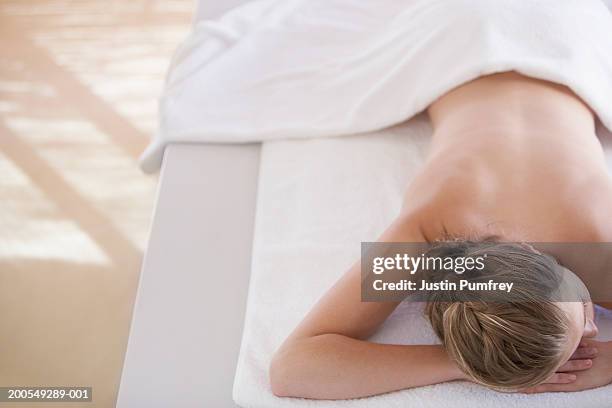 young woman lying on massage table, elevated view - lying on back ストックフォトと画像