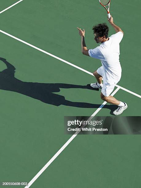 man playing tennis, elevated view - tennis shadow foto e immagini stock